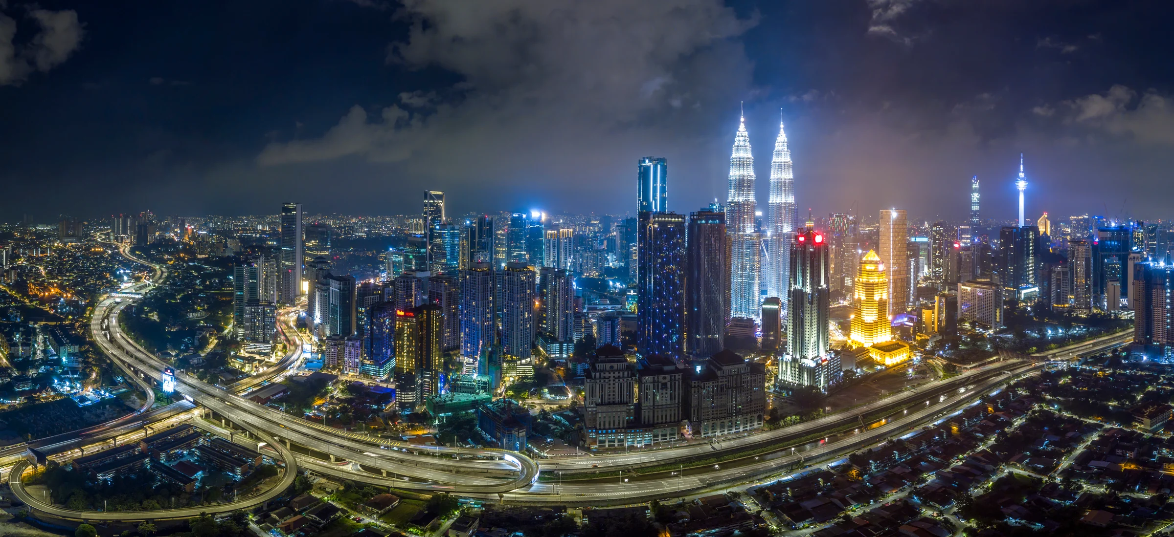 Kuala Lumpur at night, with the Petronas Twin Towers and city roads